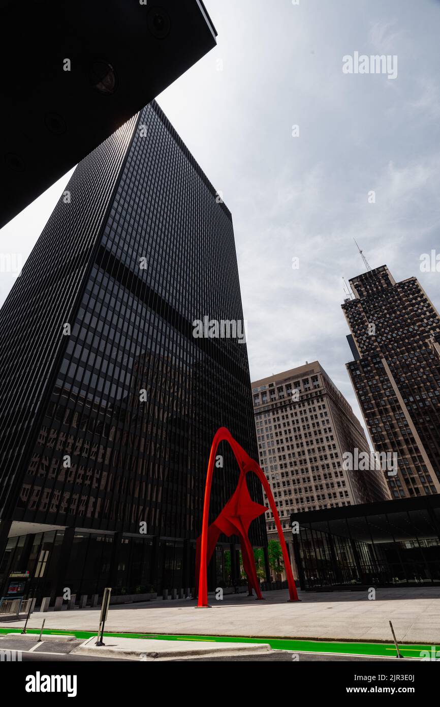 A vertical shot of red Calder's Flamingo sculpture in downtown Chicago Stock Photo