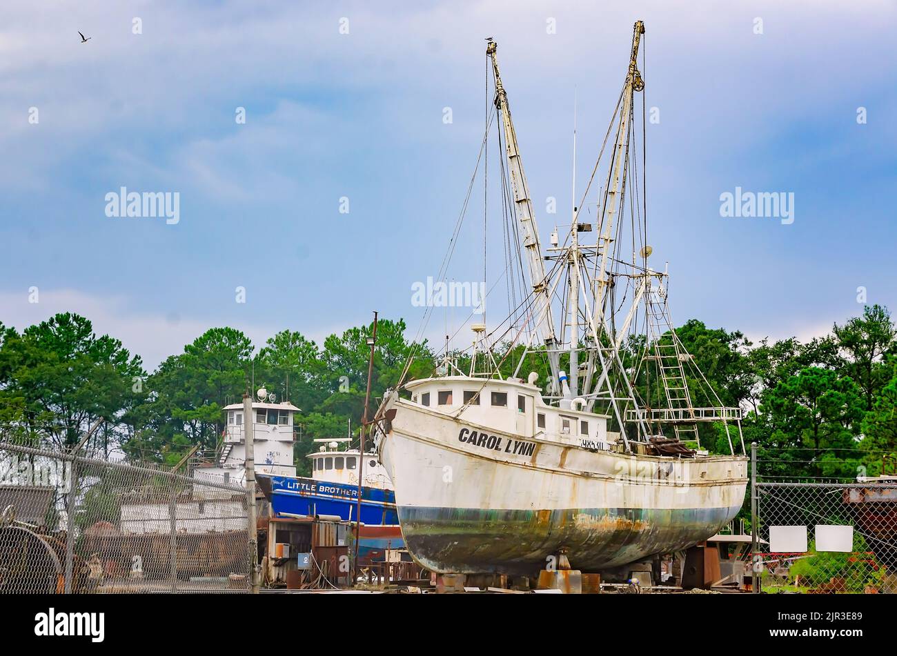 Shrimp boats sit in a shipyard while undergoing repairs, Aug. 19, 2022, in Bayou La Batre, Alabama. Stock Photo