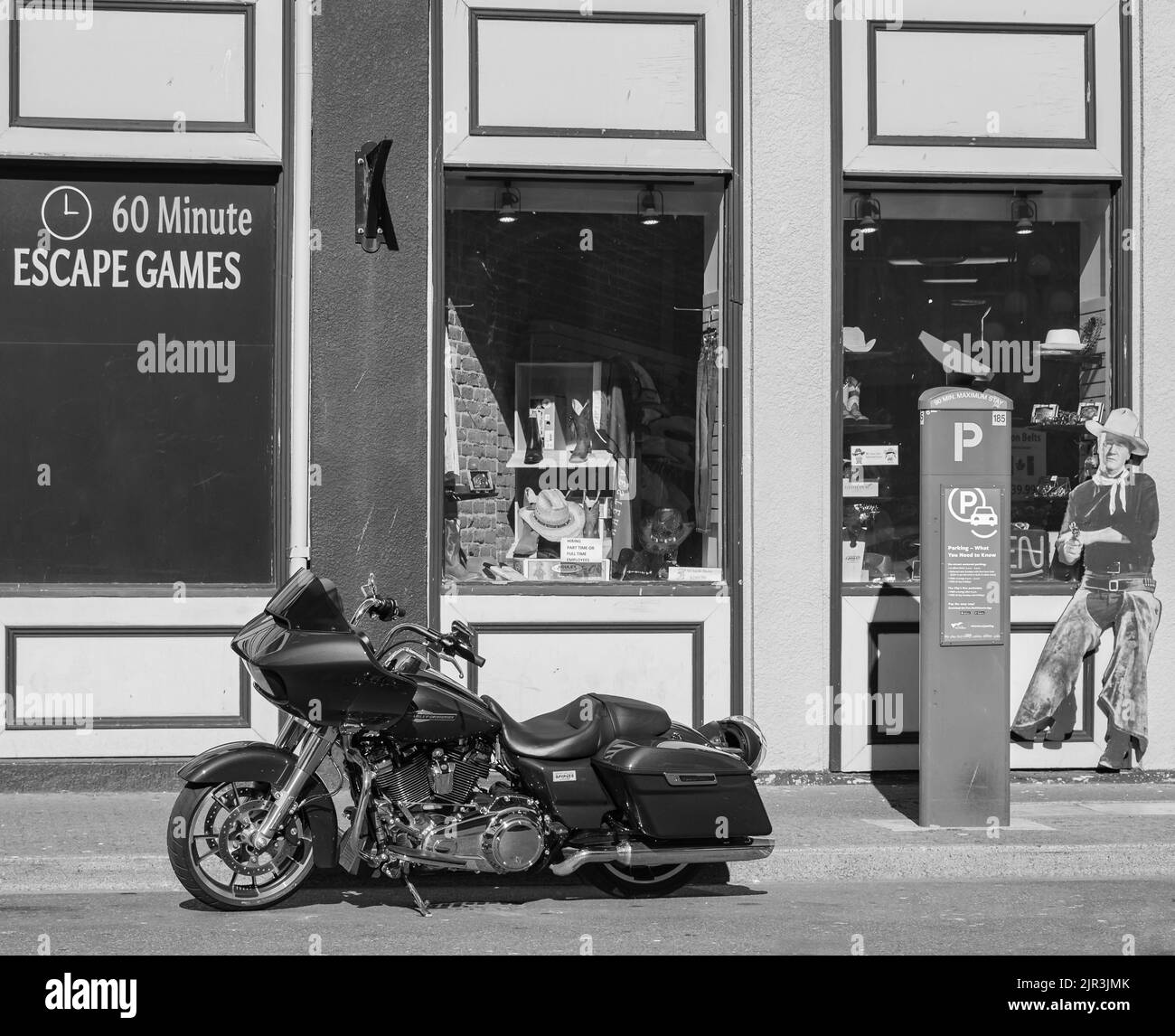 Harley Davidson Motorcycle on the city street. Black motorbike in black and white photo Stock Photo