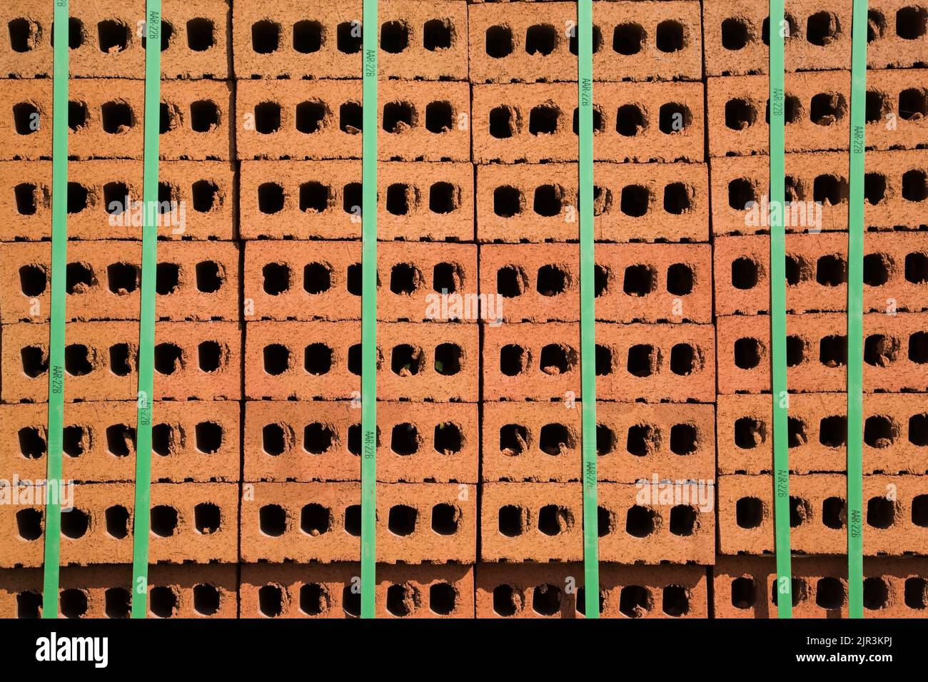 Stacked construction bricks tied with green straps, Quebec, Canada