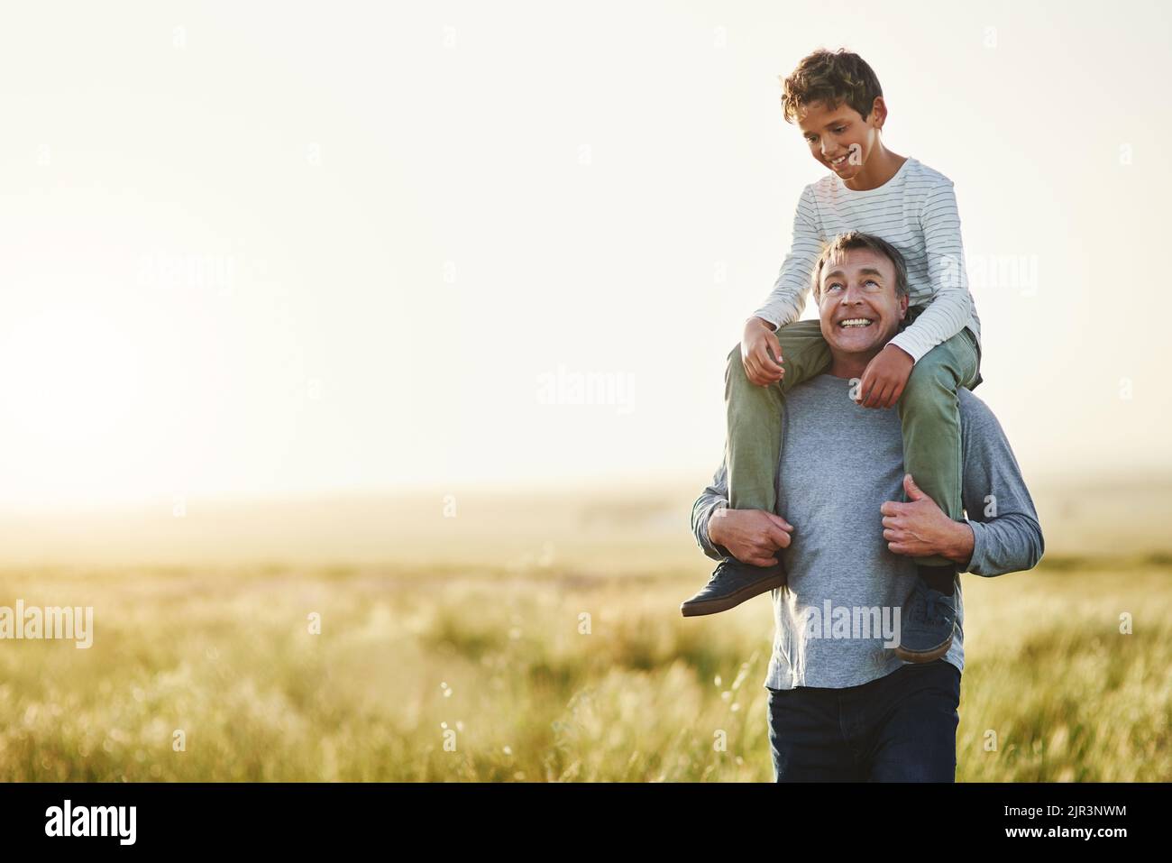 Man carrying a boy hi res stock photography and images Alamy