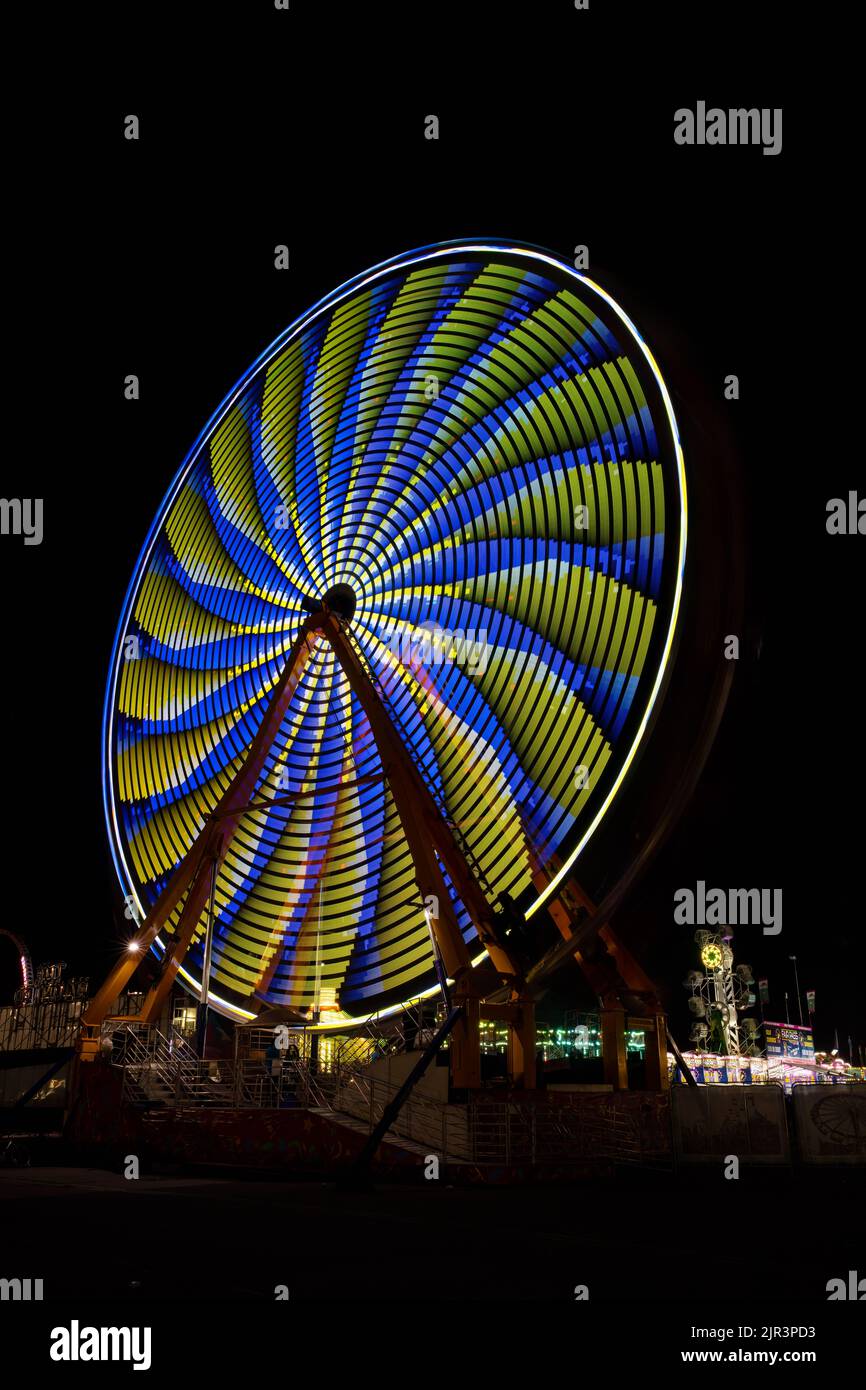 Lights on a spinning ferris wheel at night, Delaware State Fair, Harrington, Delaware Stock Photo