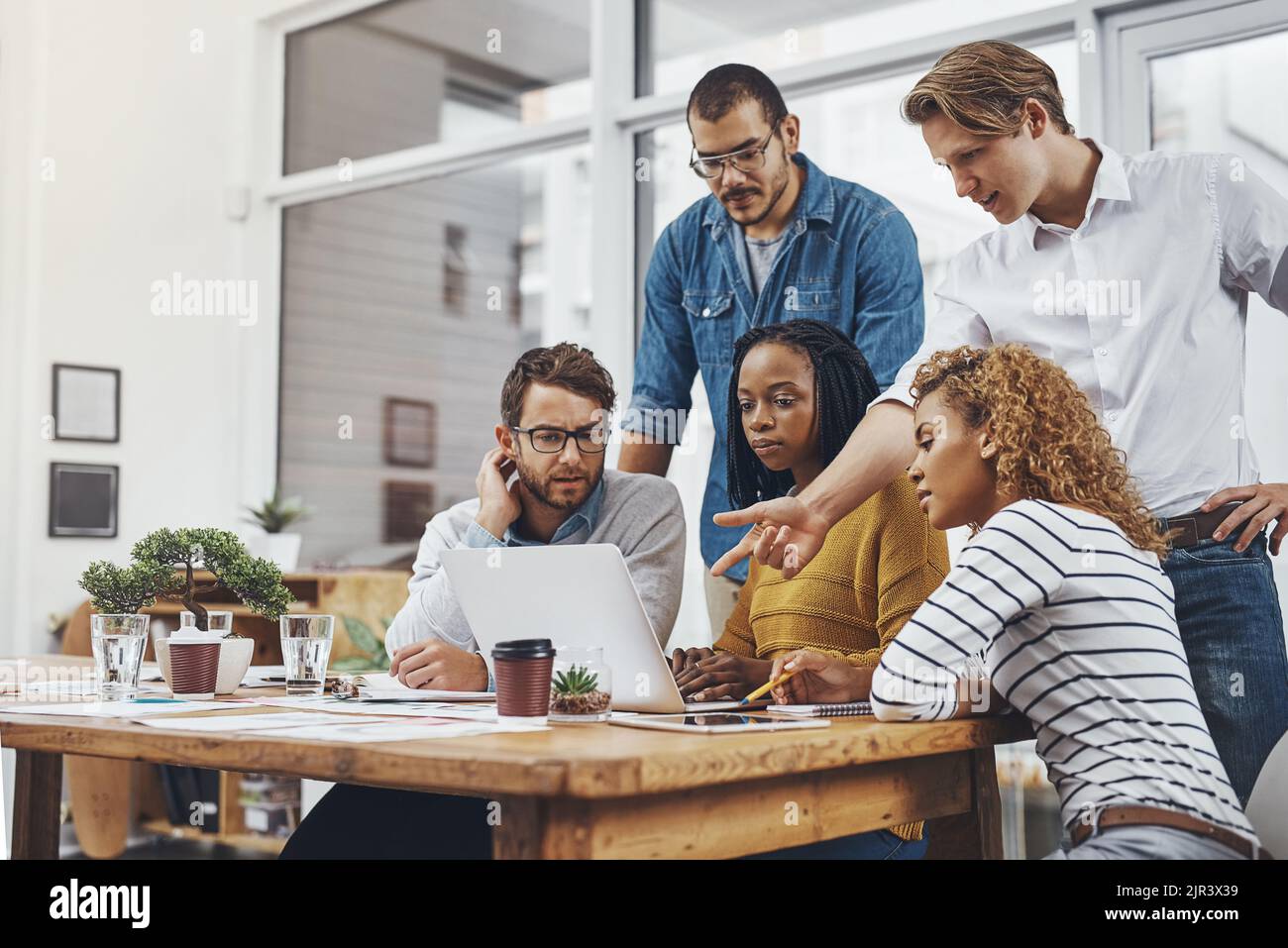 Whats that all about a group of businesspeople looking at something on