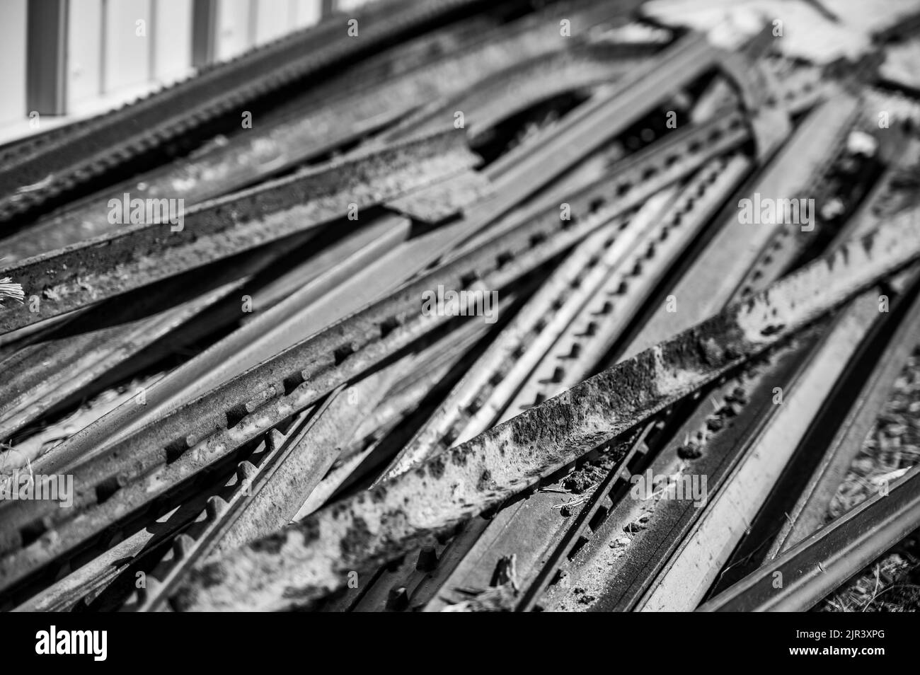 Pile of rusted steel fence posts on the ground Stock Photo Alamy