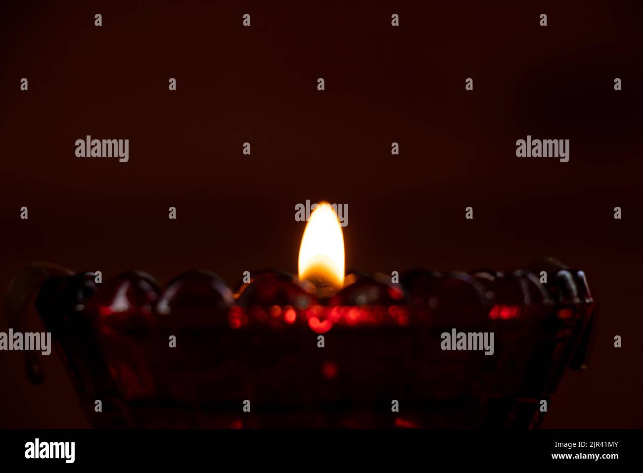 candle flame in the dark in the church, burning candle, religion Stock