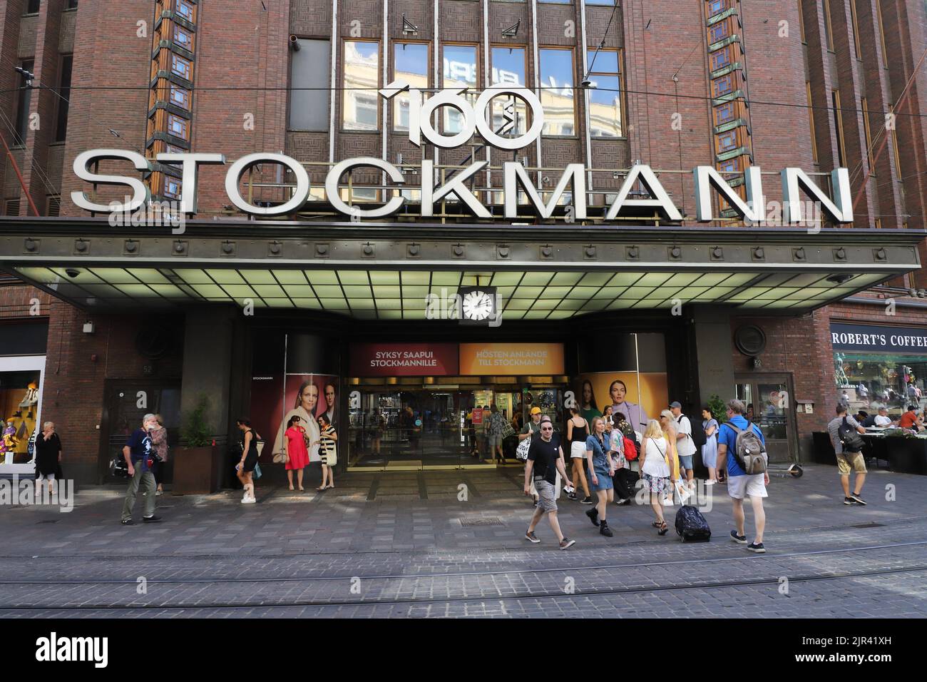 Helsinki, Finland - August 20, 2022: People at the entrance to the Stockmann department stores at the  Aleksanterinkatu street. Stock Photo