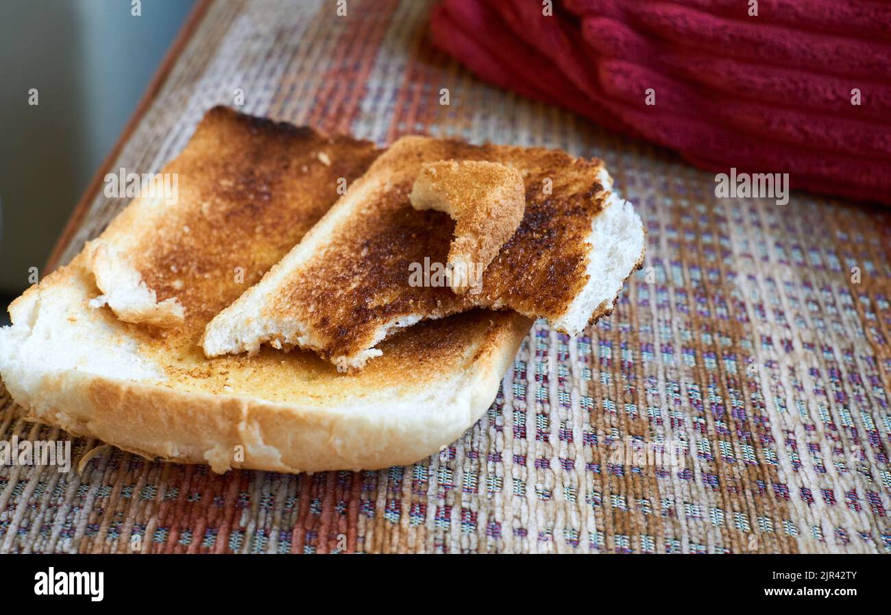 Pieces of burnt toast on a chair Stock Photo Alamy