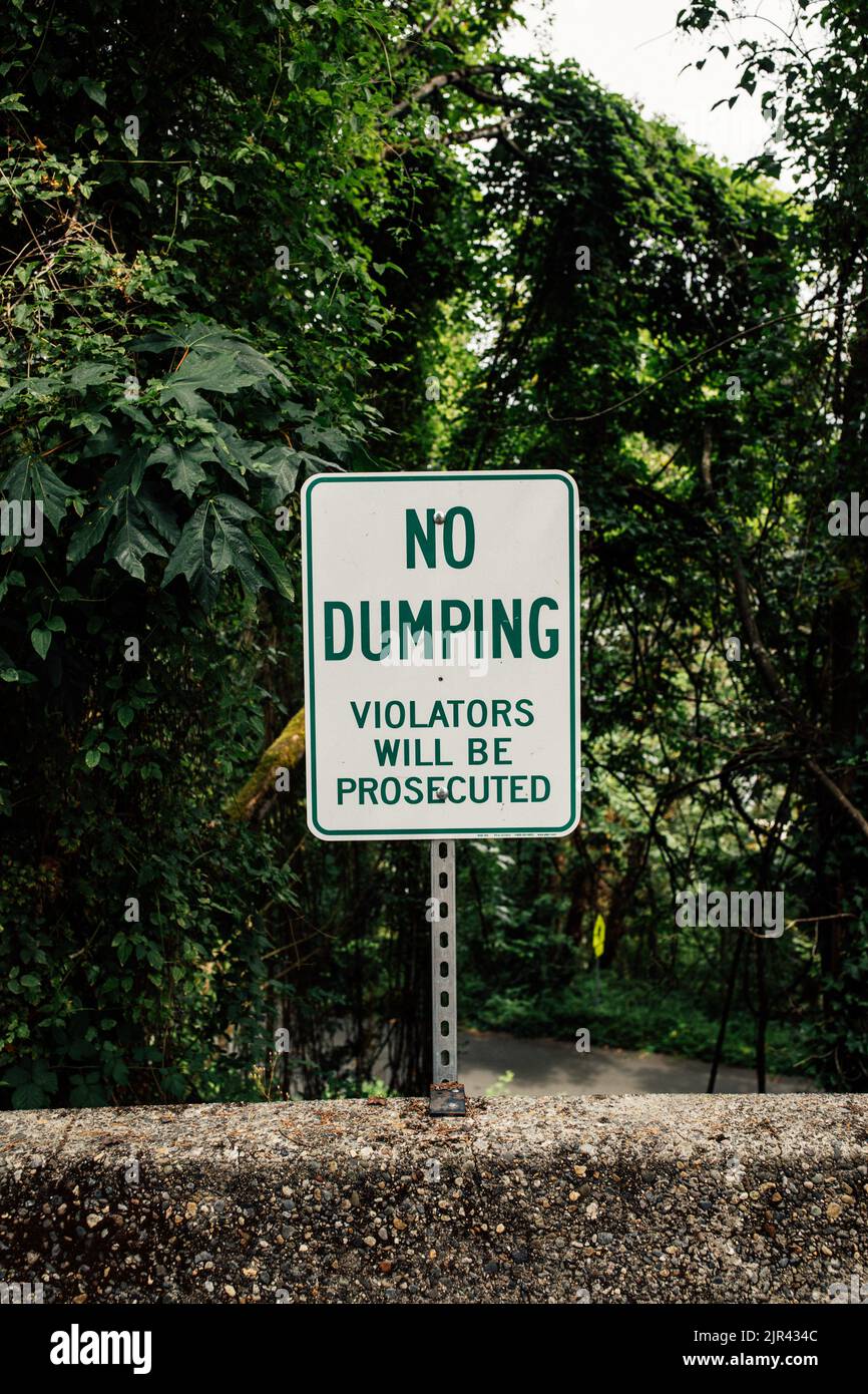 'No Dumping' warning sign, violators will be prosecuted Stock Photo