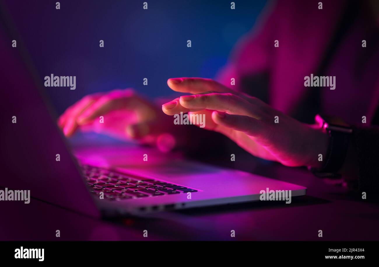Female manager is using laptop. Computer and hands close up. Stock Photo