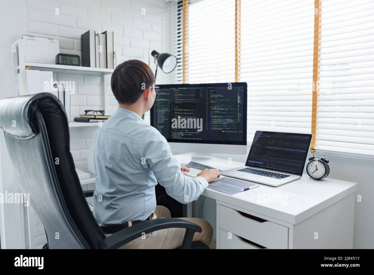 Software development concept, Male programmer typing data code and ...