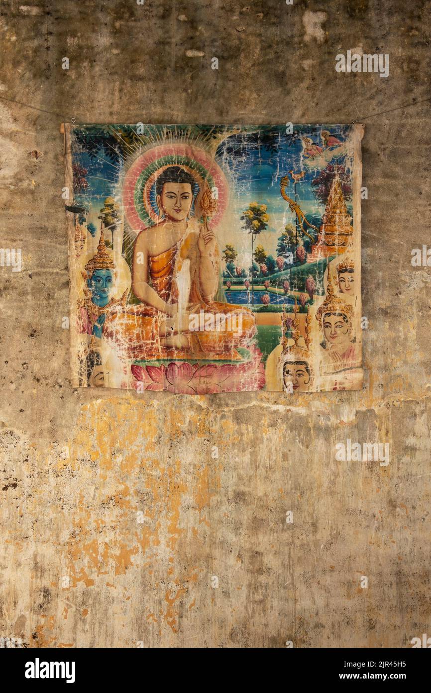 old painted print of buddha on decayed wall in cambodia asia Stock Photo