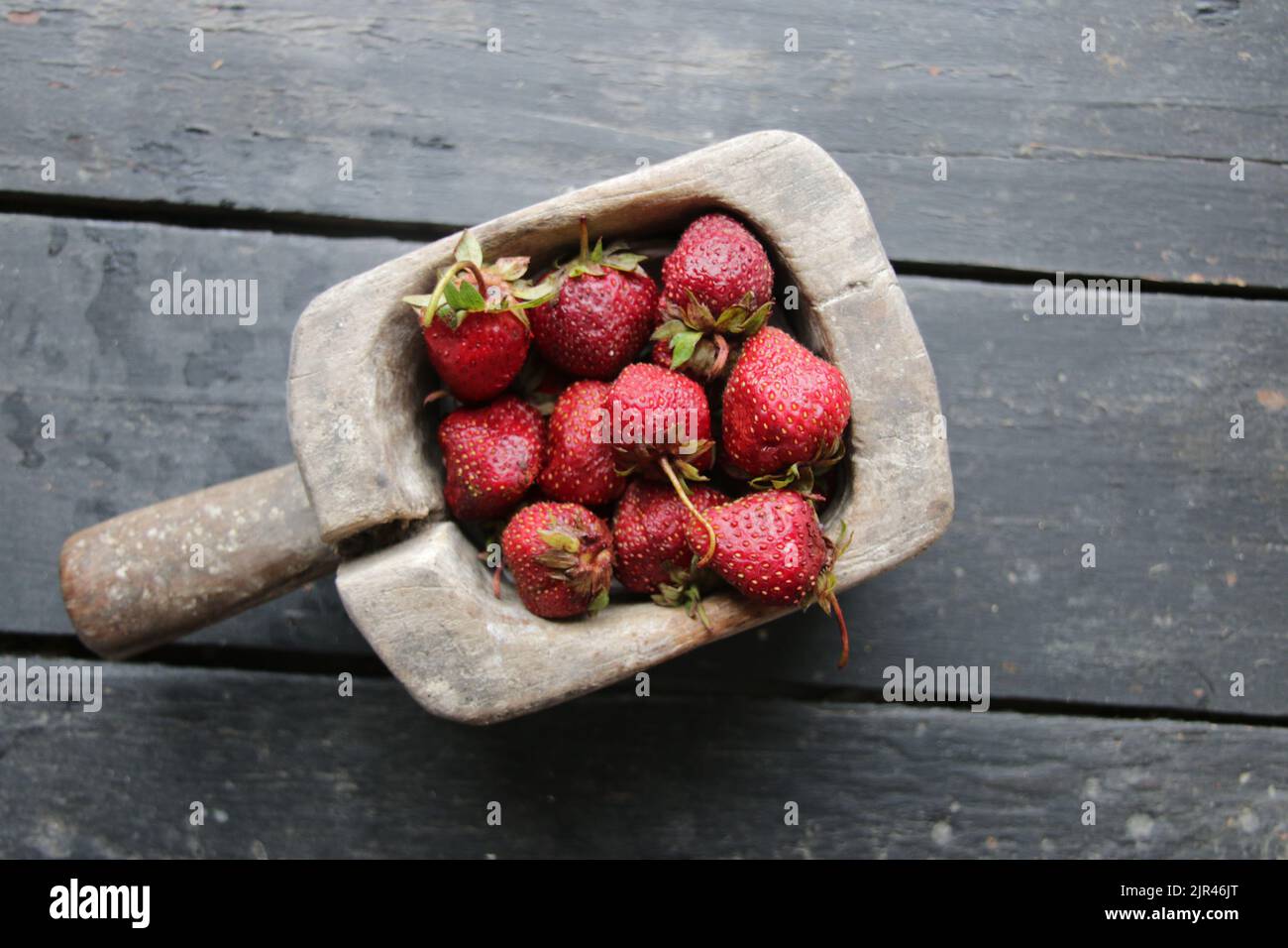 Juicy ripe strawberries in a wooden box. Stock Photo