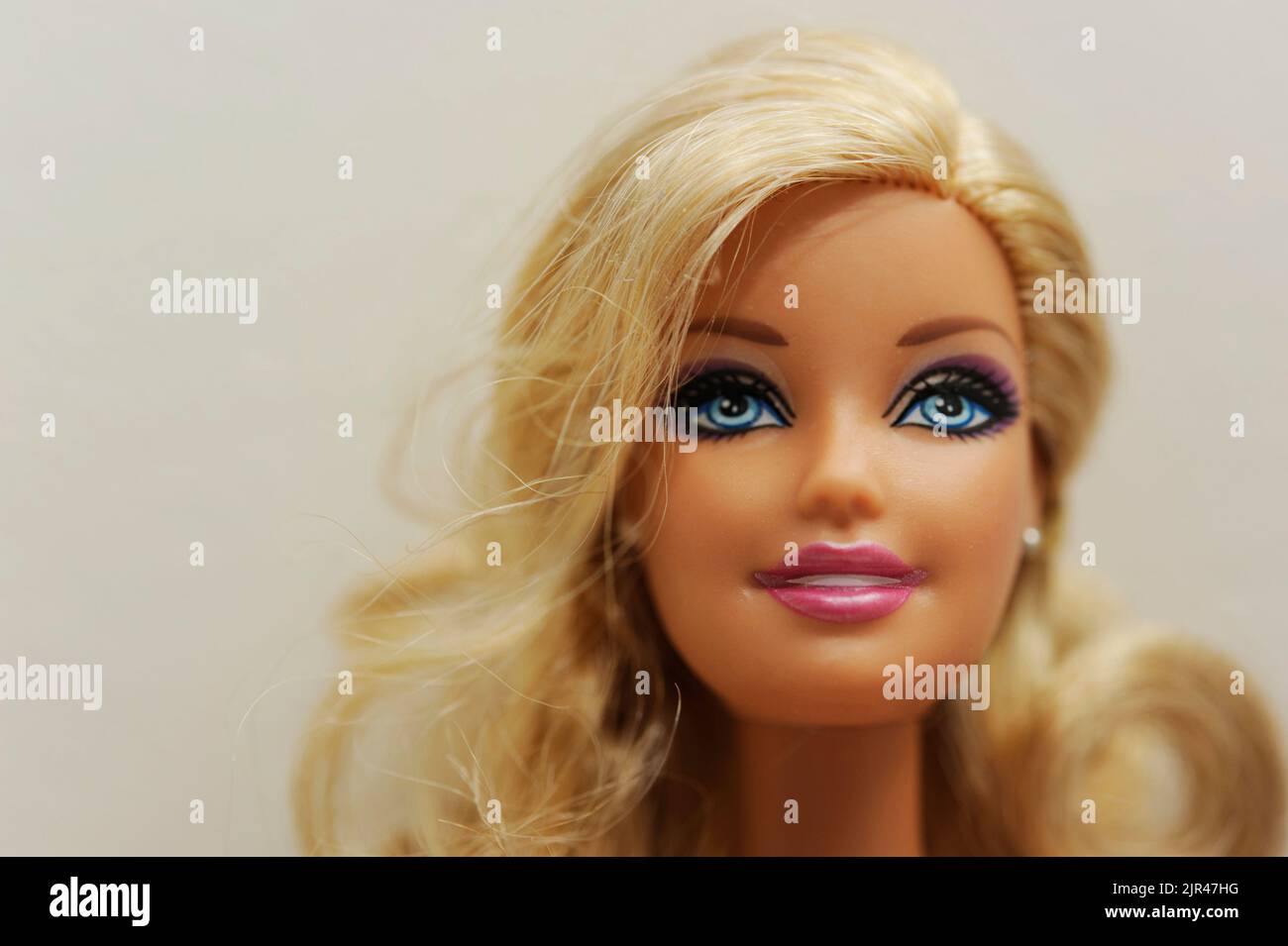 Blonde Barbie doll face close up with copy space Stock Photo