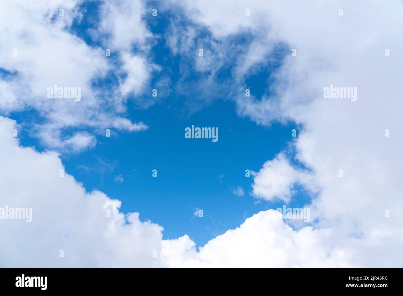 White clouds and blue sky beautiful background for postcard Stock Photo