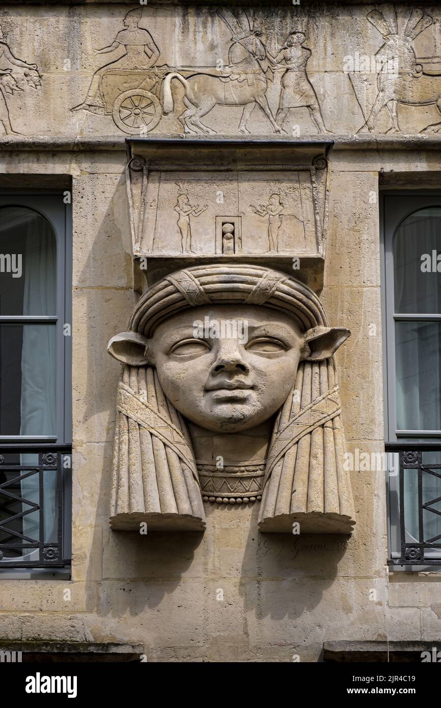 France. Paris (75) (2th district) Le Caire square : 'Egyptian' house whose facade is adorned with 3 sculpted heads of the goddess Hathor. detail of th Stock Photo