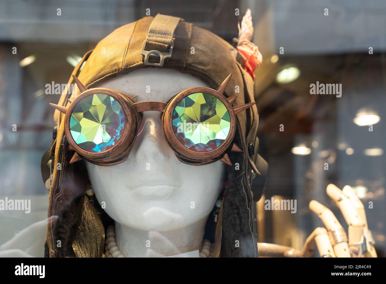 Mannequin or dummy head with funky sunglasses and leather hat on