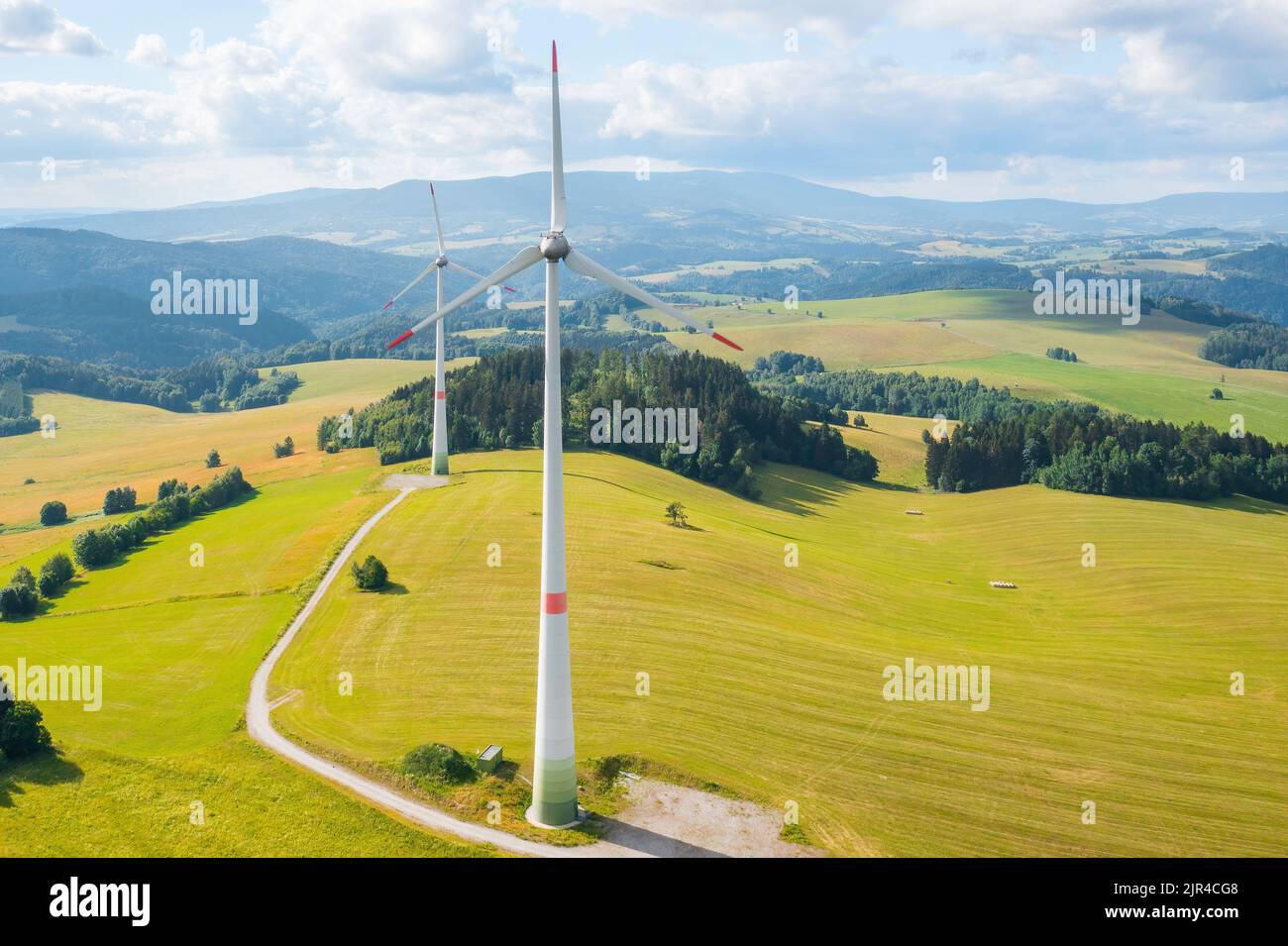 Aerial view of wind turbines propeller in the yellow field with amazing ...