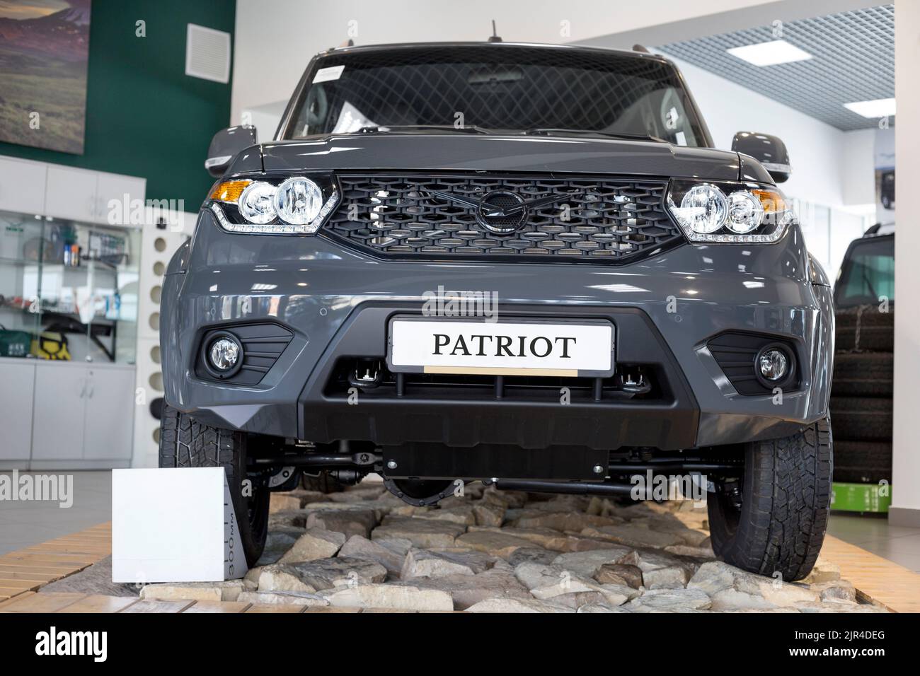 Russia, Izhevsk - August 20, 2021: UAZ showroom. New modern UAZ Patriot car in dealer showroom. Sollers automotive group. Front view. Modern transport Stock Photo