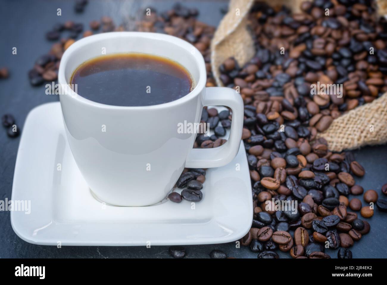 Hot coffee with fresh roasted coffee beans Stock Photo