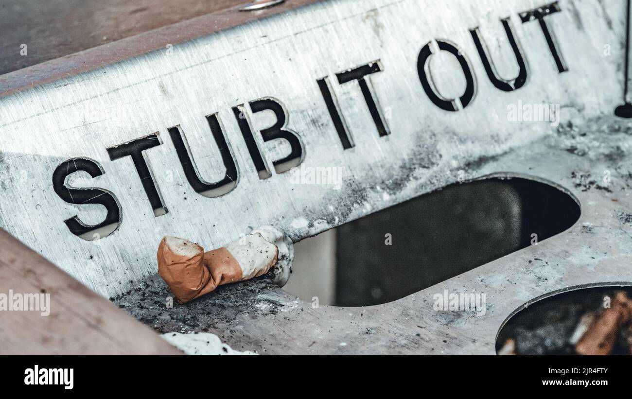 Close-Up of Cigarette Butt in “Stub It Out” Bin Stock Photo - Alamy