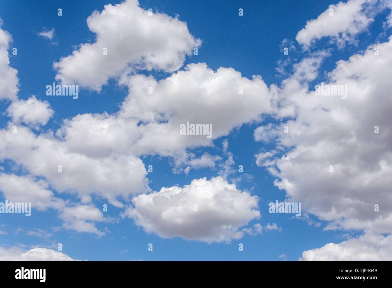 White cumulus clouds against blue sky, Seaburn, Sunderland, Tyne and Wear, England, United Kingdom Stock Photo