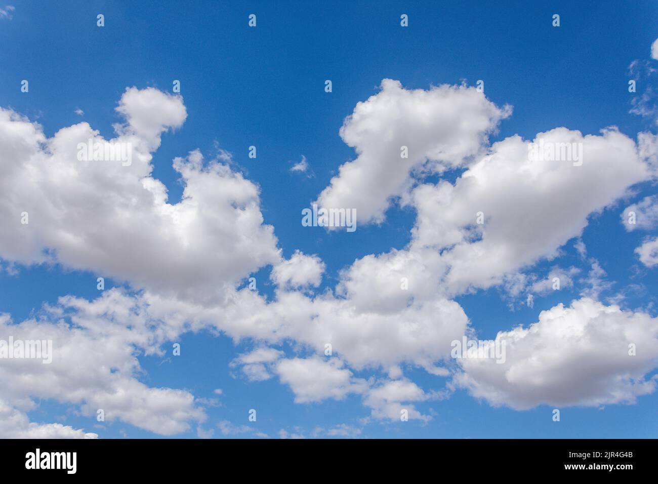 White cumulus clouds against blue sky, Seaburn, Sunderland, Tyne and Wear, England, United Kingdom Stock Photo