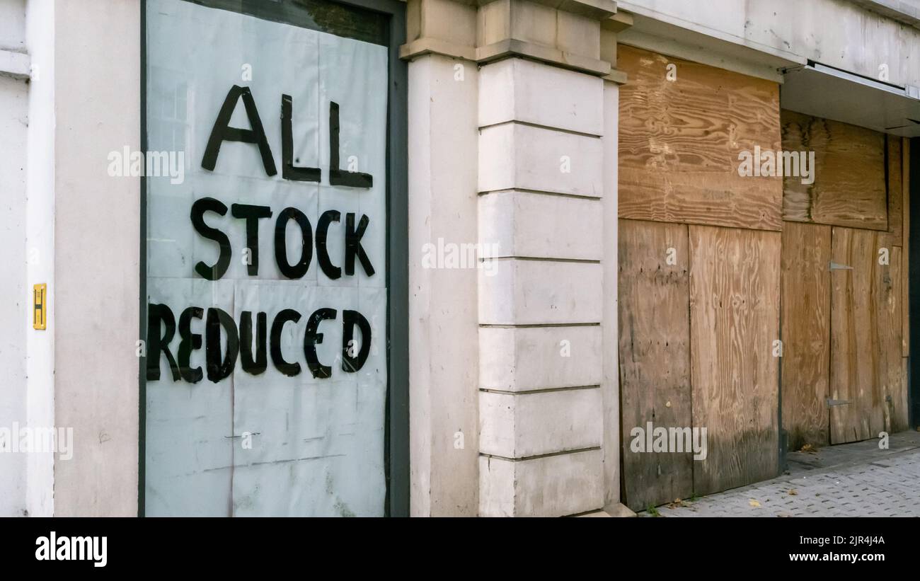 All Stock Reduced Sign on Empty Retail Storefront Stock Photo - Alamy