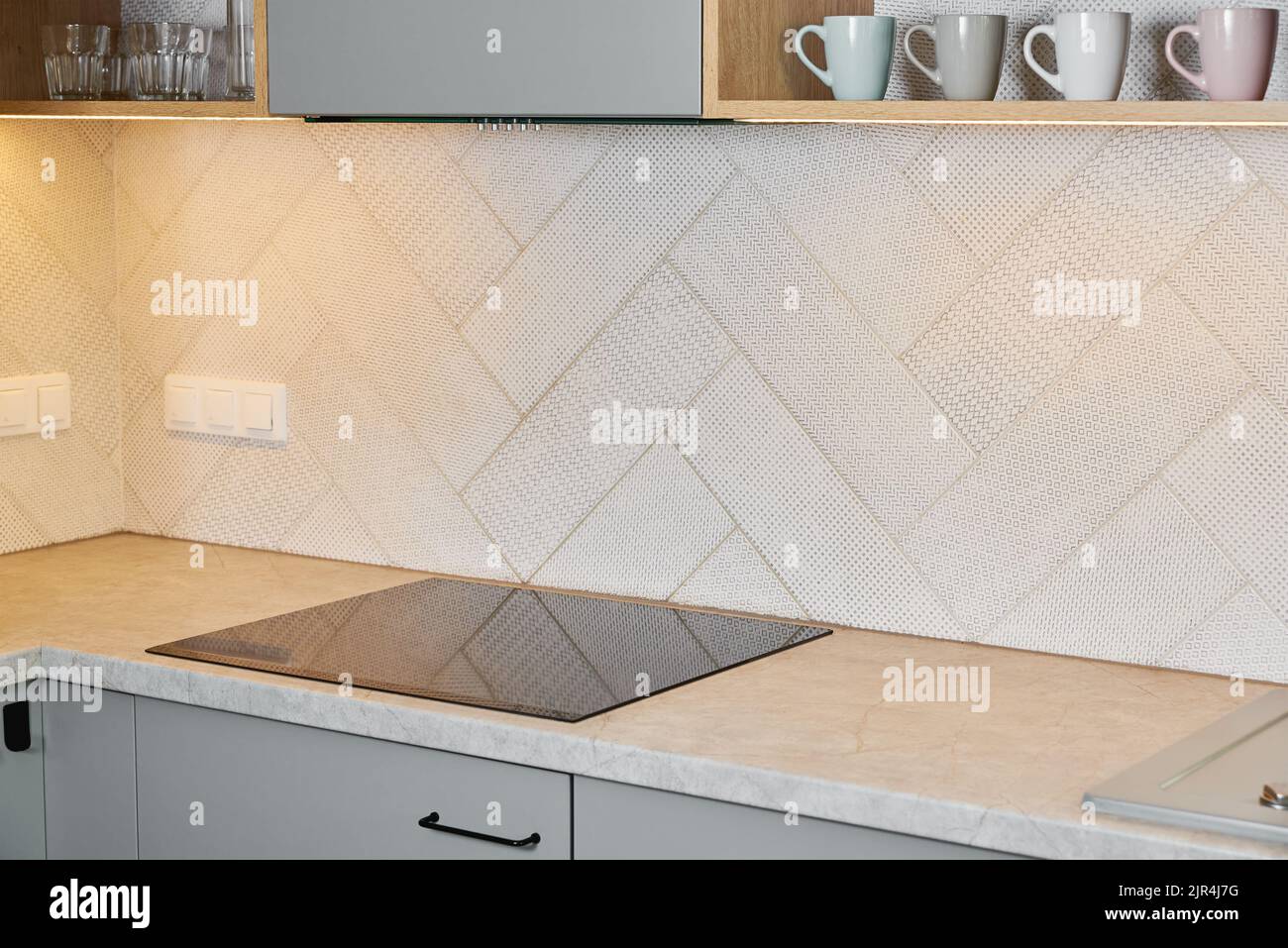 Kitchen interior with induction hob and wooden Modern kitchen appliance Stock Photo