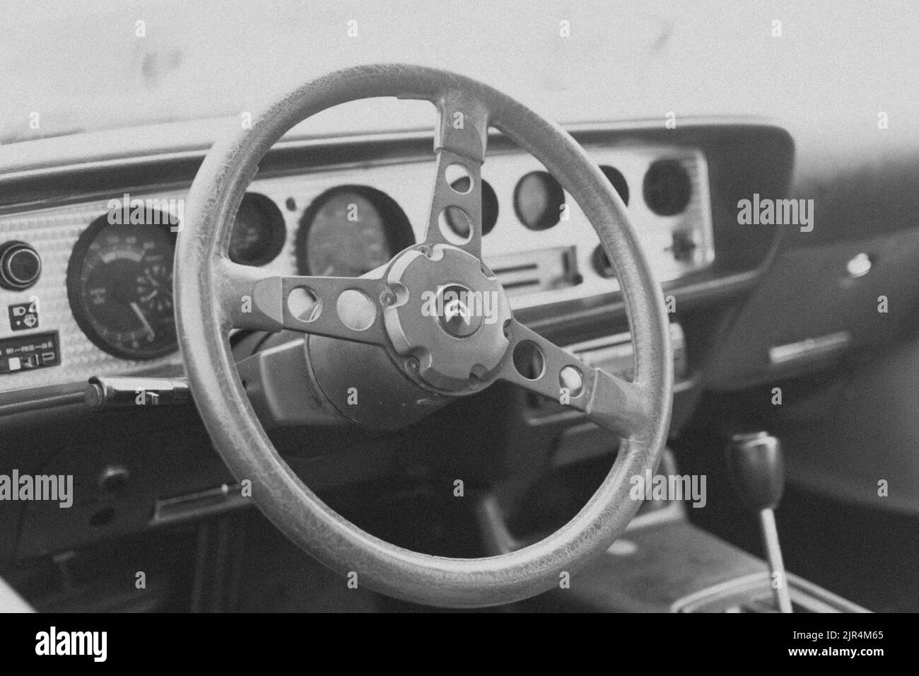 A closeup grayscale shot of the inside of Pontiac Firebird Trans AM car Stock Photo
