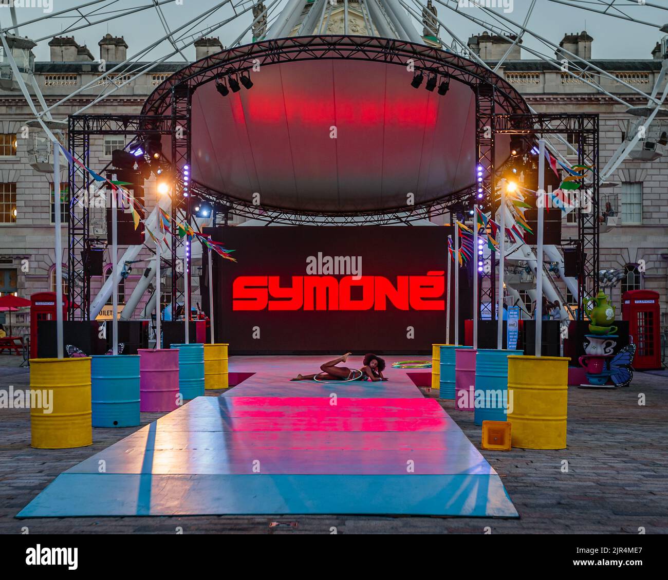 Symoné, the amazing Hula Hooper performs at This Bright Land in the courtyard of Somerset House, London. Stock Photo