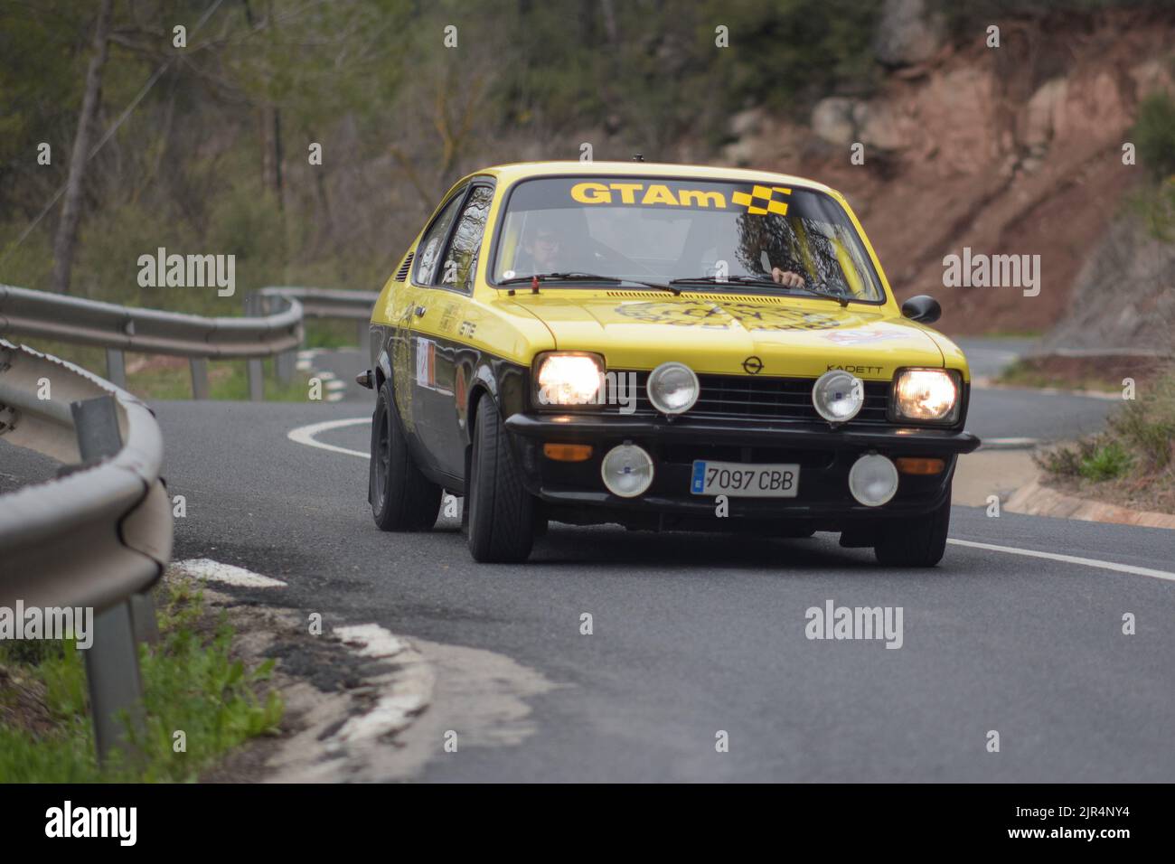 A classic black and yellow Opel Kadett GT-E in the asphalt rally Stock Photo