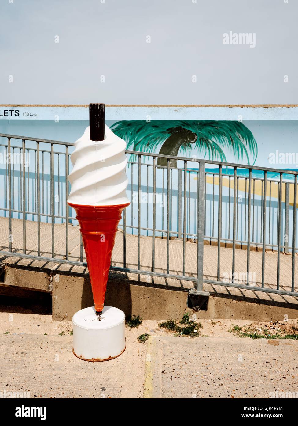 The painted sea wall mural palm tree art on the coast at Canvey Island