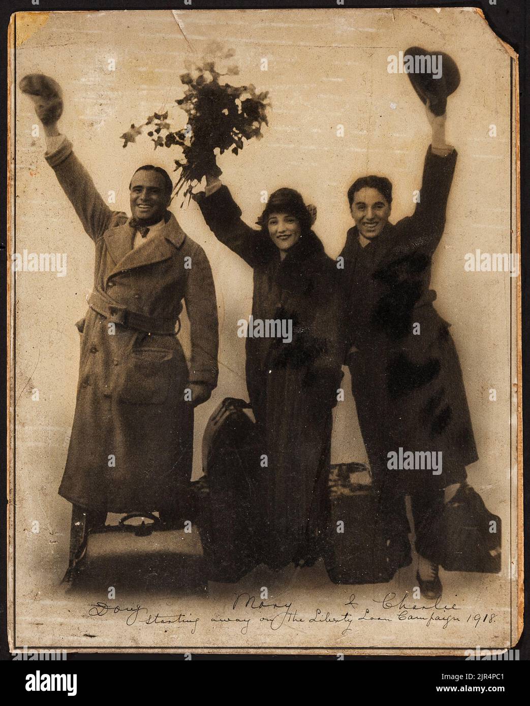 Charlie Chaplin, Douglas Fairbanks, and Mary Pickford (United Artists founders, 1918). Vintage photo of the three film stars. Stock Photo