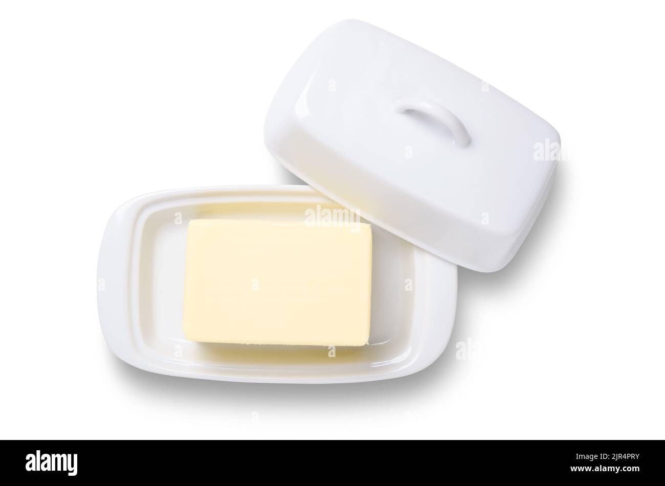 Butter in white ceramic butter dish shot from overhead isoaetd on white with clipping path Stock Photo