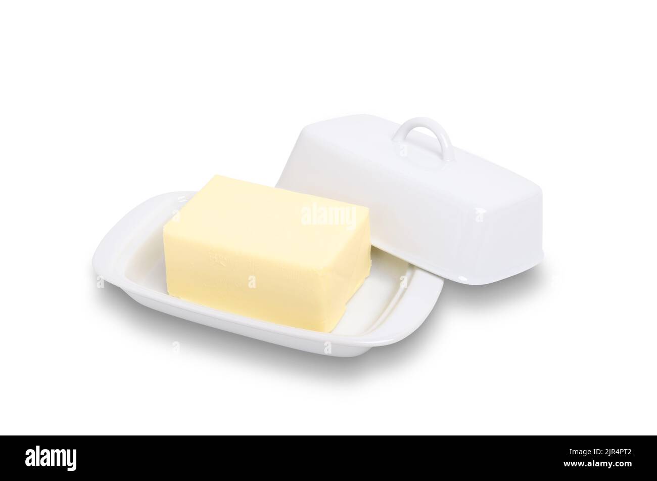 Block of butter in white ceramic butter dish isolated on white with