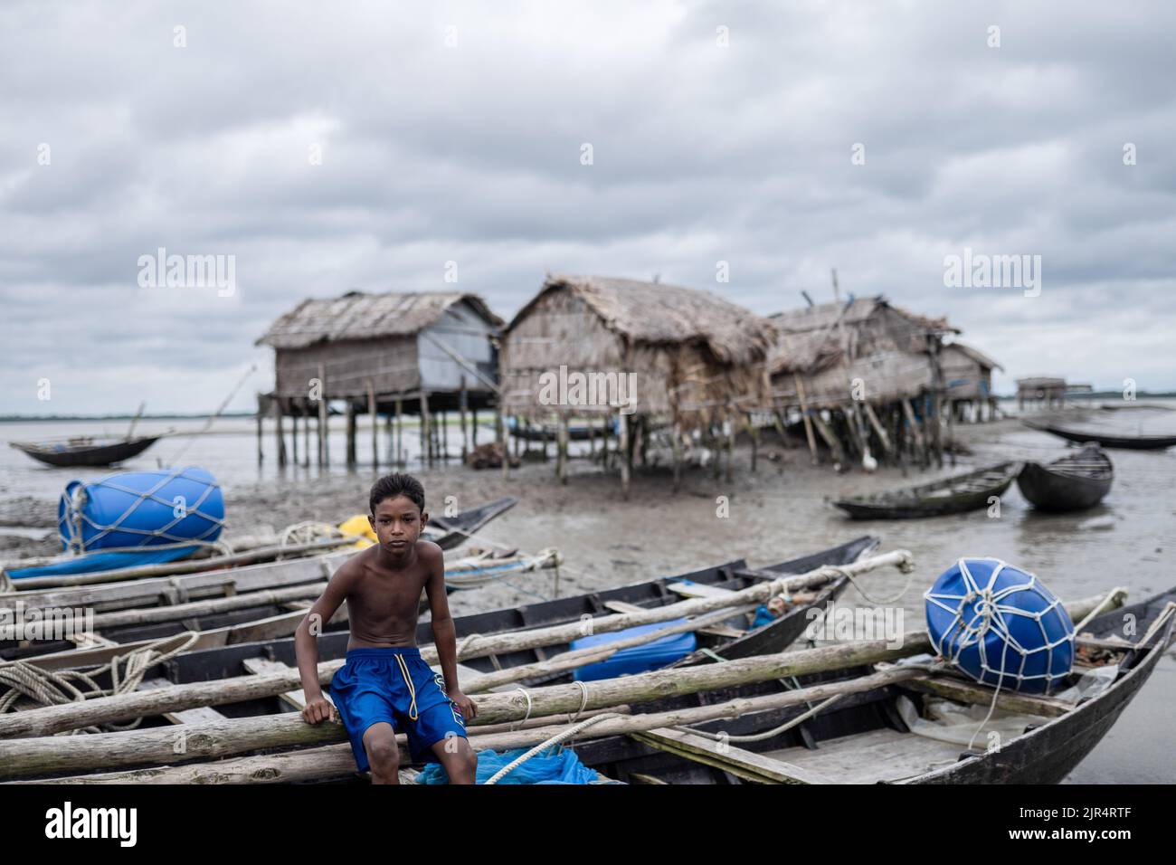 A boy poses for a photo at Kalabogi village in Khulna. Not too long ago ...