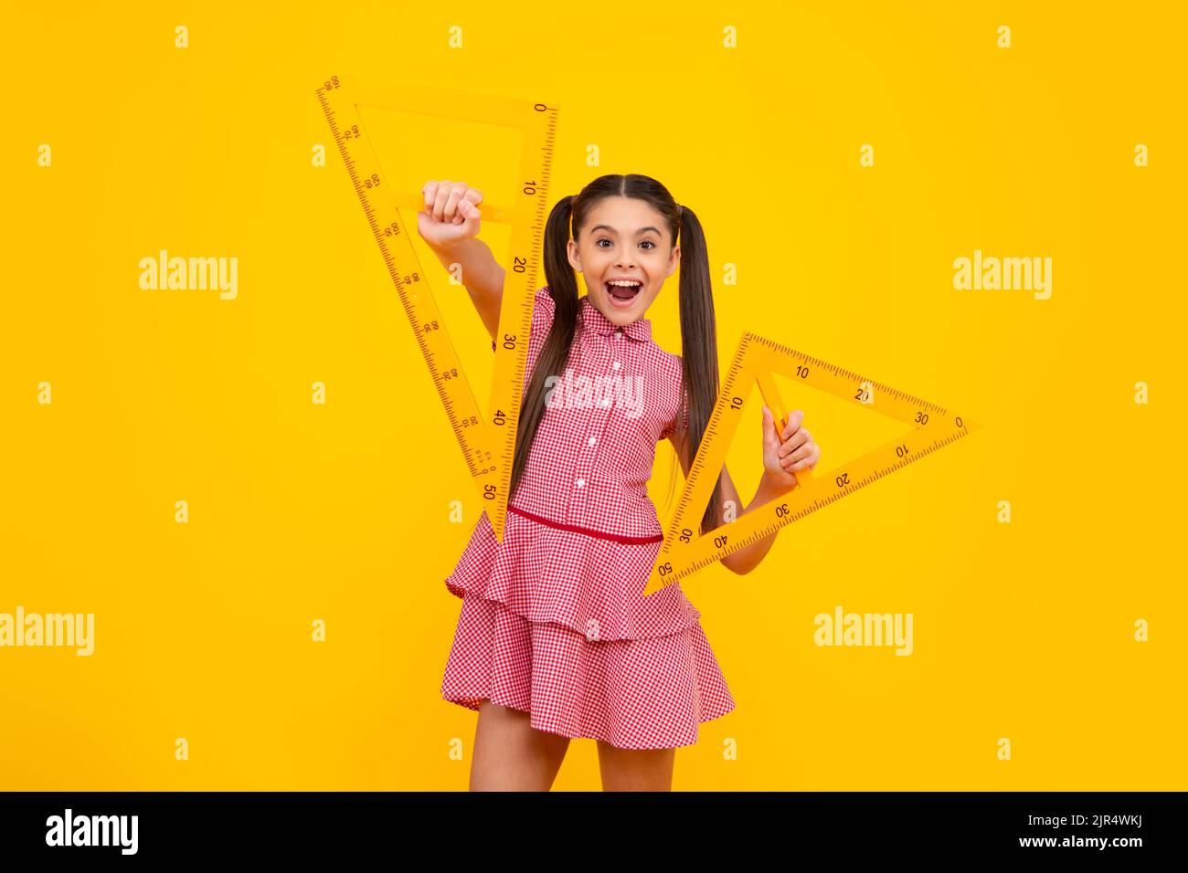 Teenager child school girl holding measure for geometry lesson