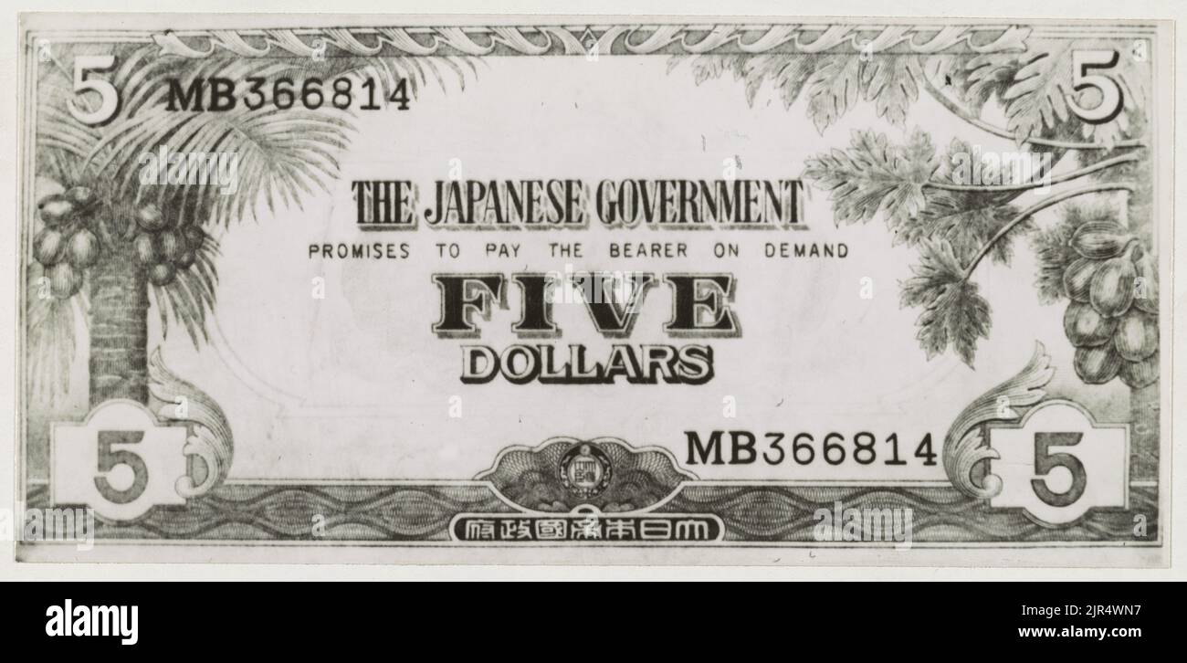 A vintage photo circa 1942 showing a fake five dollar bill issued by the Japanese army during the invasion of Malaya and the fall of Singapore. Japanese invasion money, officially known as Southern Development Bank Notes as a replacement for local currency after the conquest of colonies and other states in World War II. Stock Photo