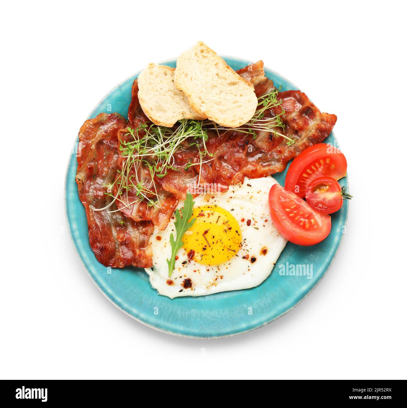 Plate of tasty fried egg and bacon on white background Stock Photo - Alamy