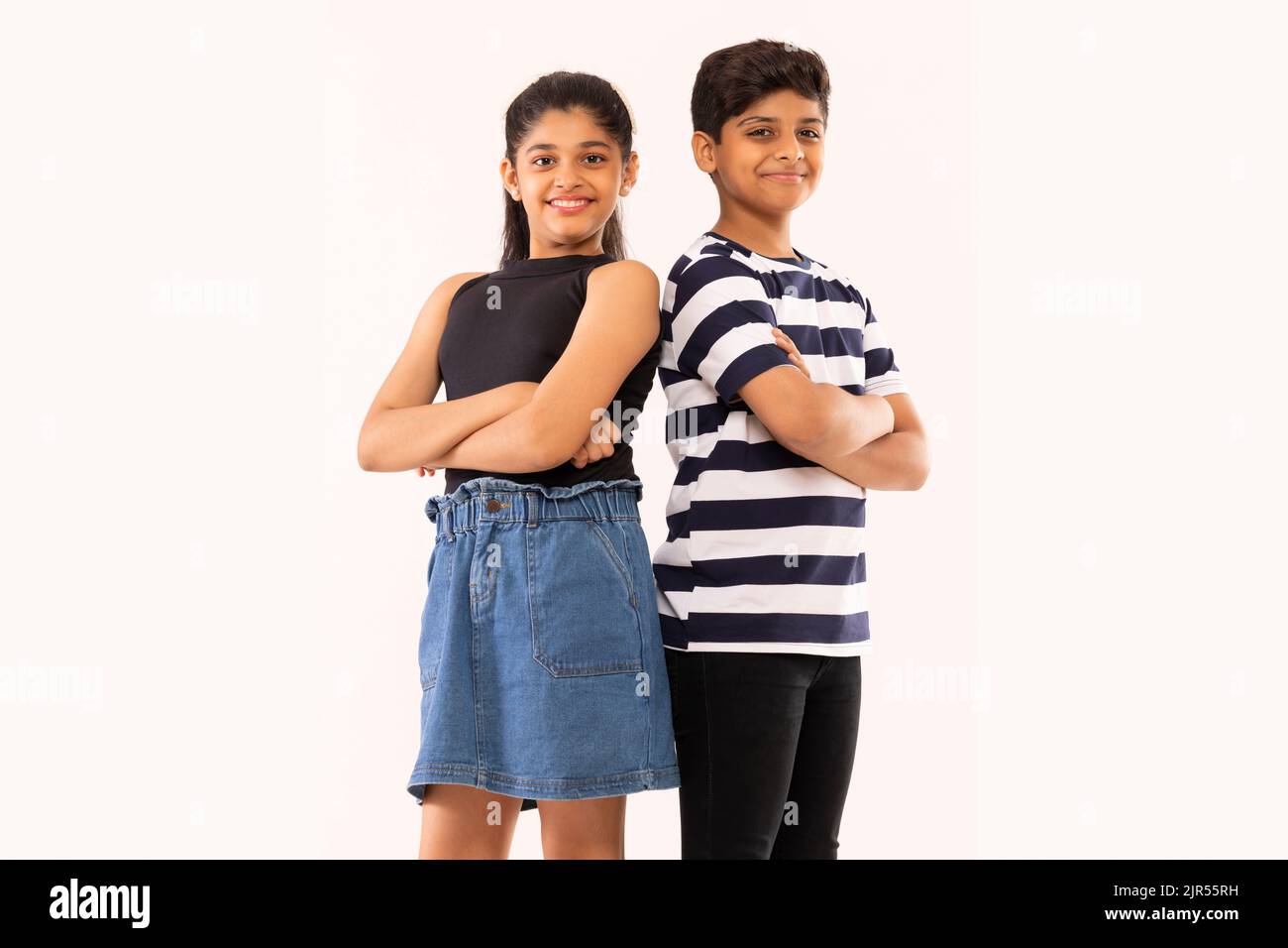 Boy girl standing back to back hi-res stock photography and images - Alamy