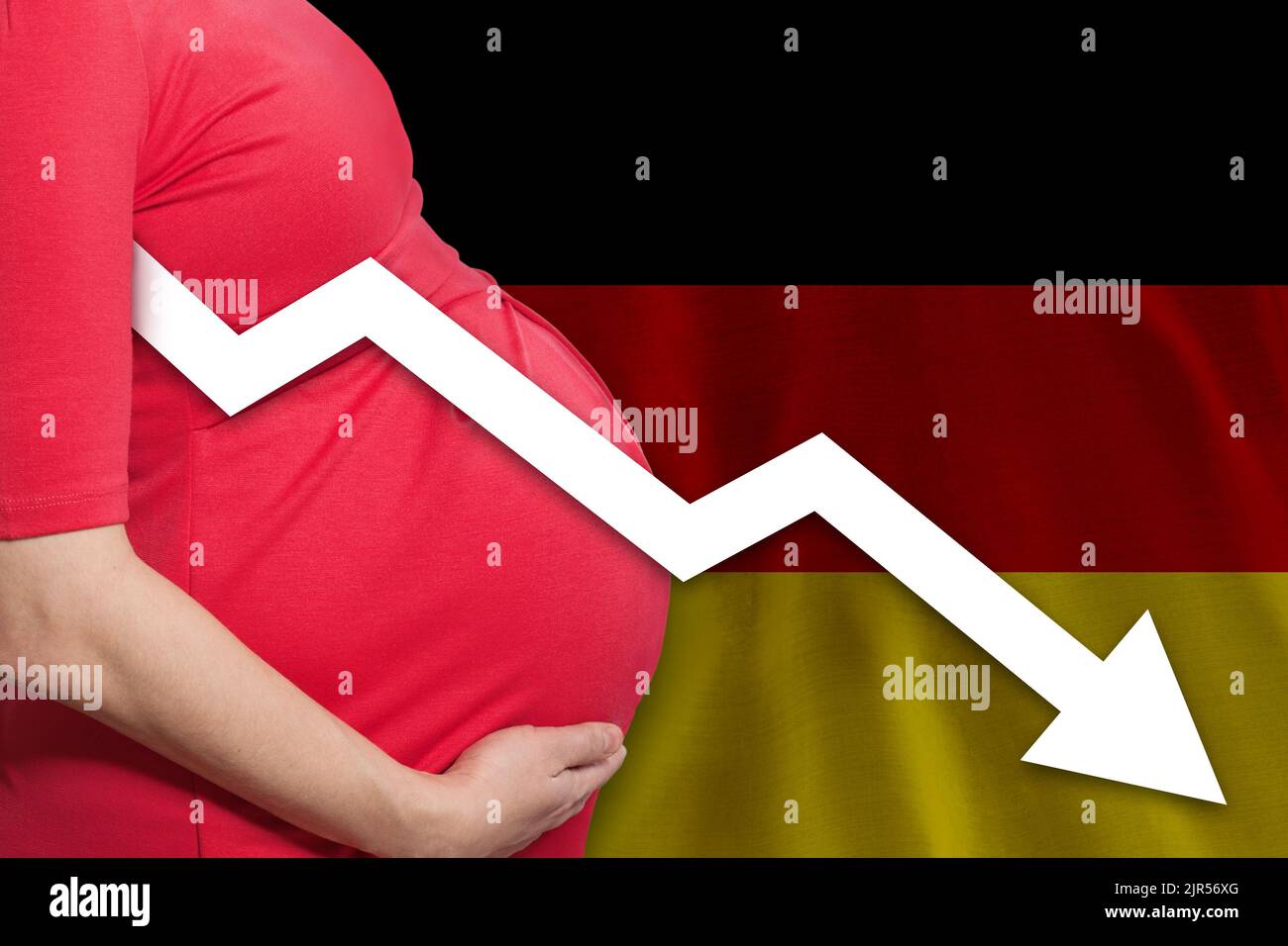 German pregnant woman on German flag background. Falling fertility rate