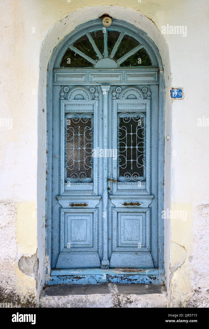 Decorated door to a house in the, semi abandoned, village of Antartiko, Prespes municipality, Florina,  Macedonia. Greece. The village has suffered fr Stock Photo