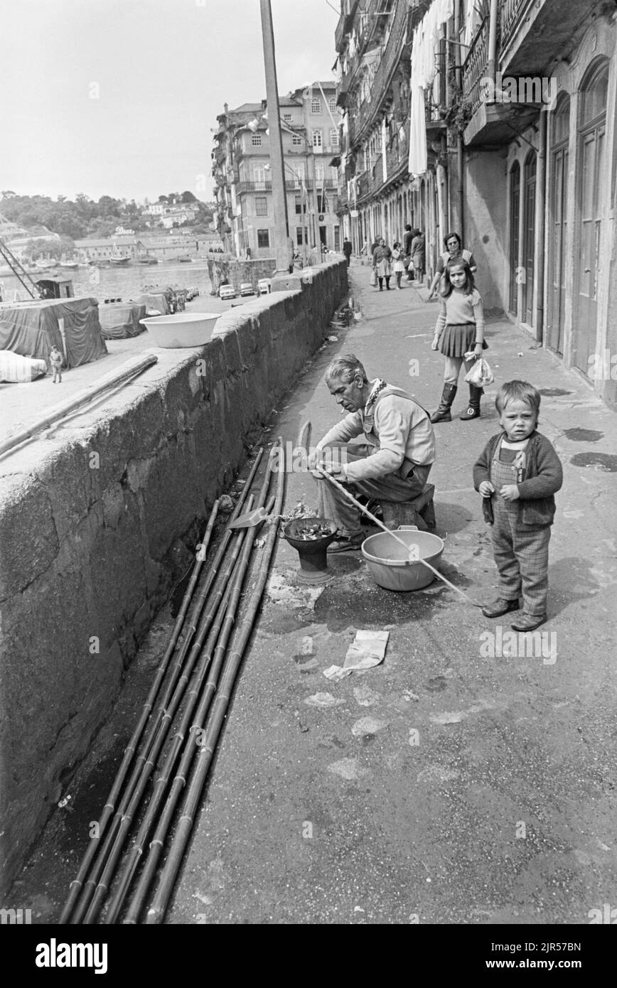 PORTUGAL - PORTO -  1970. Making bamboo fishing rods on the Cais da Estiva waterfront of the river Douro  in the Ribeira district of Porto, Northern P Stock Photo