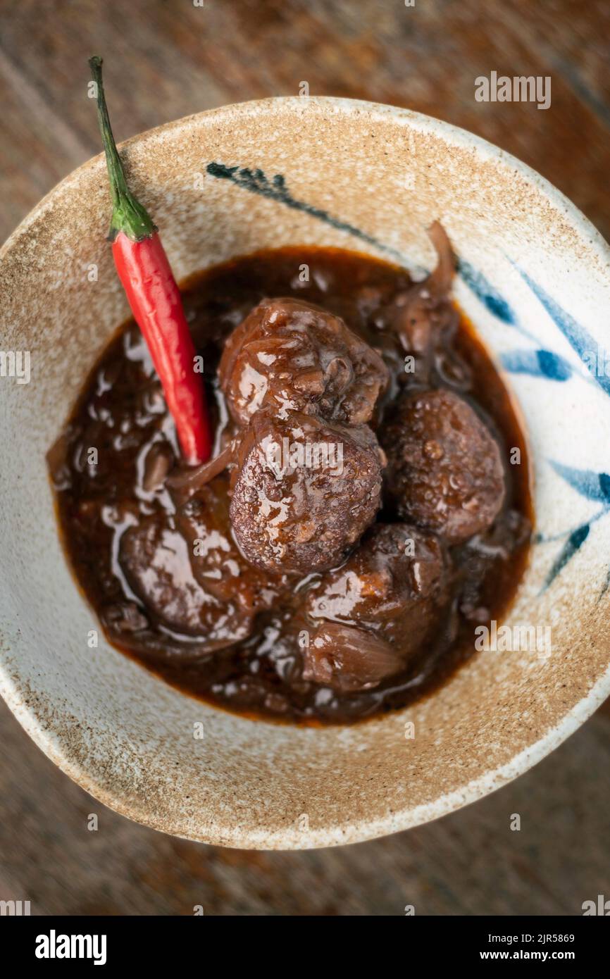 spicy chilli chorizo sausage in red wine escabeche sauce tapas Stock Photo Alamy