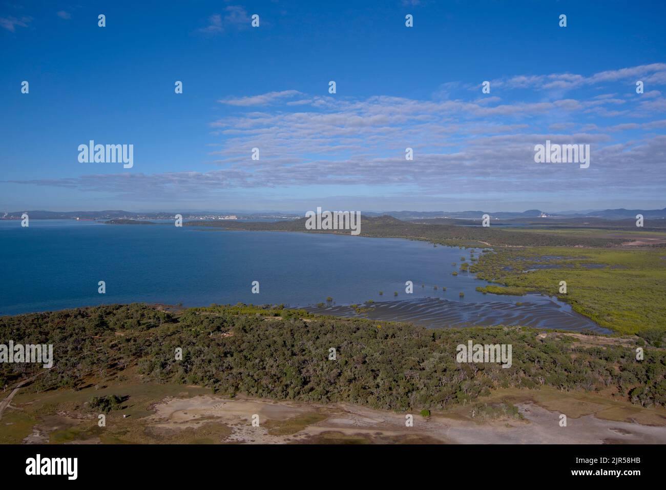 Looking across from Southend on Curtis Island to Gladstone Queensland Australia Stock Photo