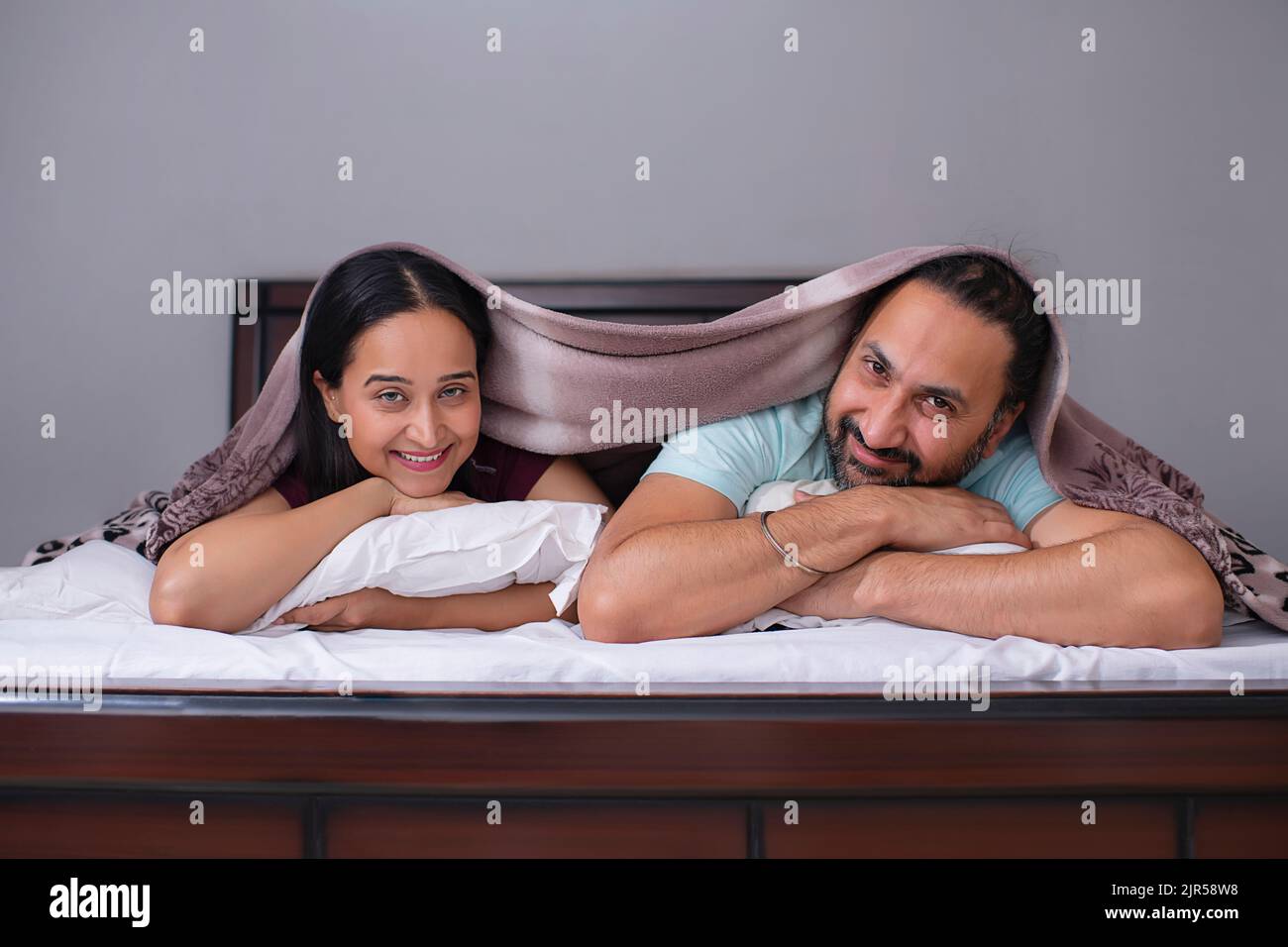 Couple lying together hi-res stock photography and images - Alamy