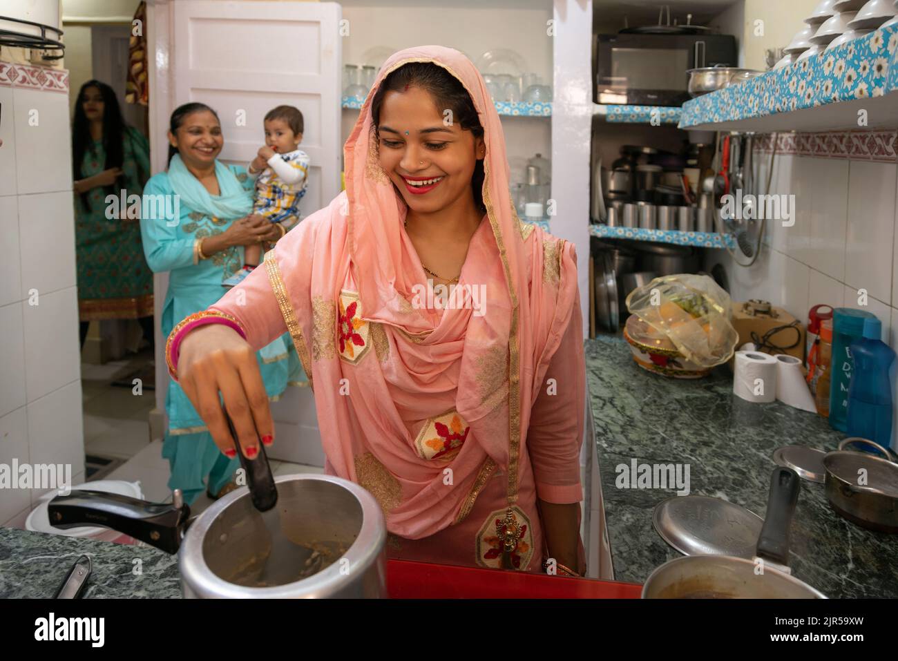 Woman using modern multi cooker in kitchen Stock Photo - Alamy