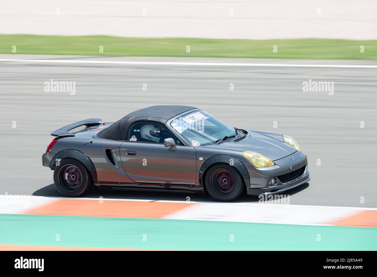 A classic gray Toyota Mr2 midship Japanese sports car on the racing