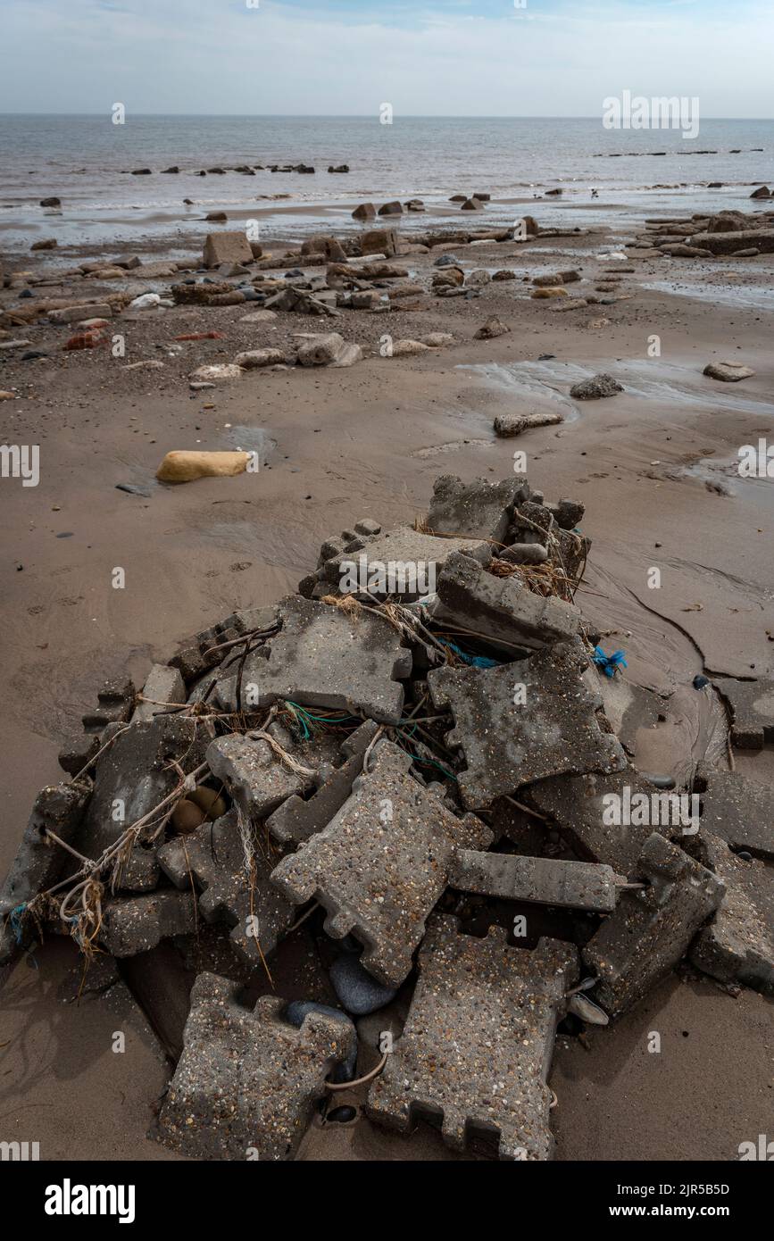 Ruined and eroded bits of road surface and military buildings on Spurn Head, East Yorkshire, UK Stock Photo