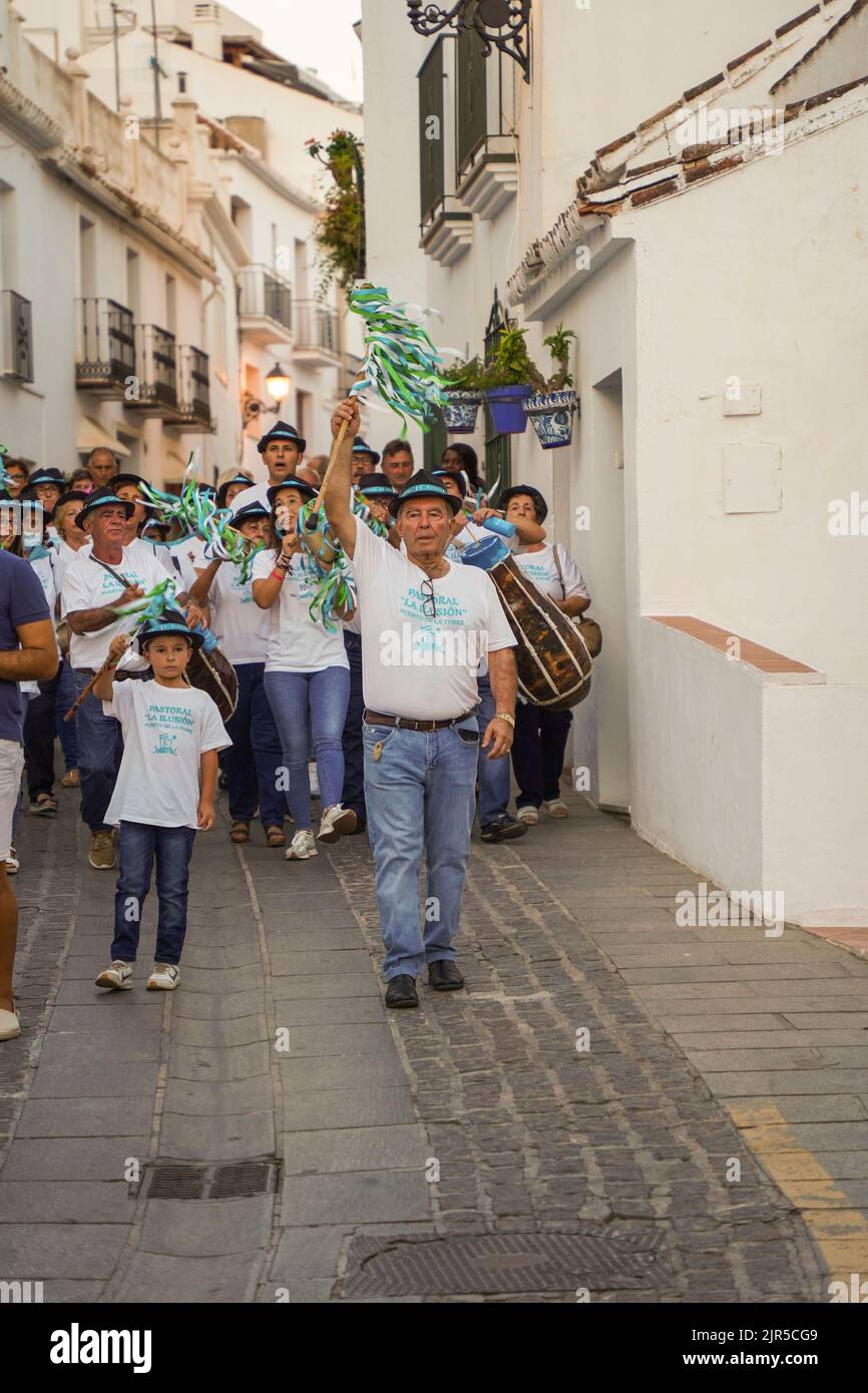 Groups of spanish Pastorales singing typical Christmas Carols, with Zambomba instruments, as an exception in summer. Mijas, Spain. Stock Photo